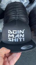 Doin’ Man Shit! BIG logo front Trucker Hat